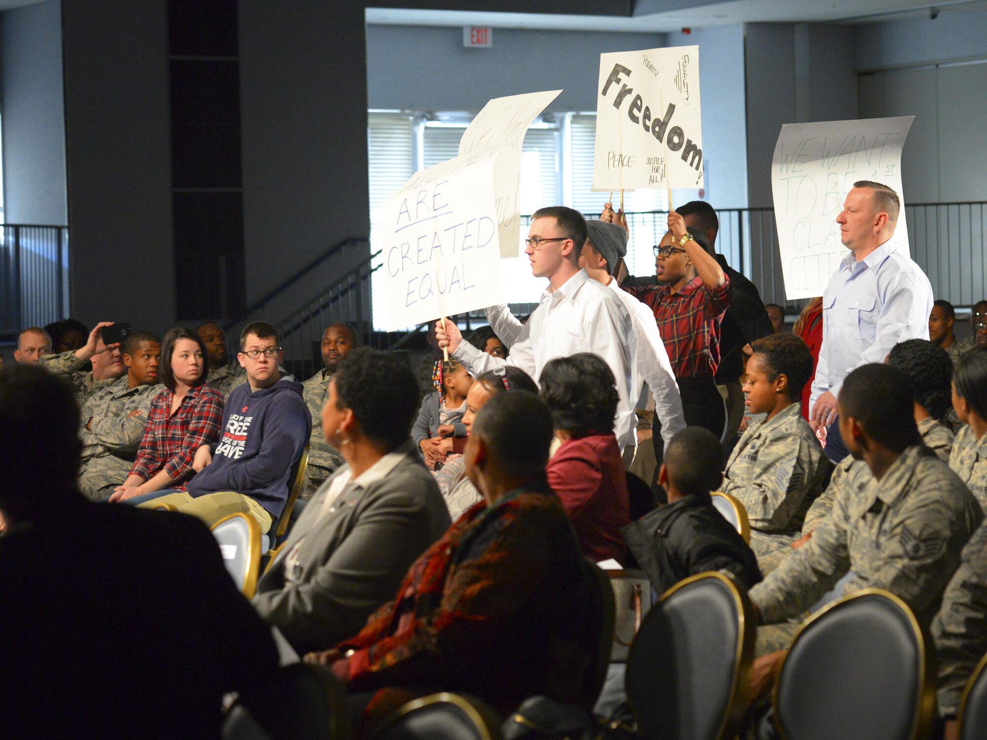 An audience applauds after the showing of “The Story of a Dream,” a play chronicling African American suffrage of the mid 1950s at Yokota Air Base, Jan. 12, 2017. Airmen acted out major events in the life of Martin Luther King Jr., who helped bring about the Civil Rights Act of 1964 and the Voting Rights Act of 1965. The values of freedom and equality which King fought for continue to be highly valued in the Air Force today. (U.S. Air Force photo by Senior Airman Elizabeth Baker) (U.S. Air Force photo by Senior Airman Elizabeth Baker)