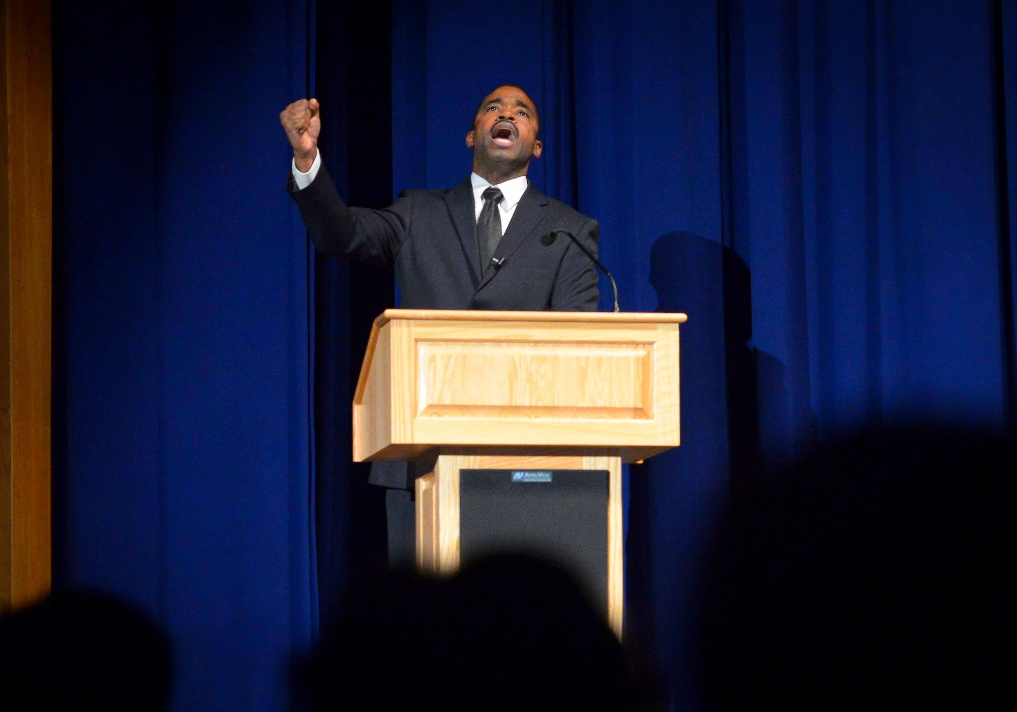 Staff Sgt. Jason Hamm, 374th Security Forces Squadron combat arms instructor, shouts “Free at last!” during his portrayal of Martin Luther King Jr. for “The Story of a Dream,” a play chronicling African American suffrage of the mid 1950s at Yokota Air Base, Jan. 12, 2017. The Martin Luther King Jr.’s Special Observance Committee produced the play and an art exhibit in observance of Dr. Martin Luther King Day. The values of freedom and equality which King fought for continue to be highly valued in the Air Force today. (U.S. Air Force photo by Senior Airman Elizabeth Baker)