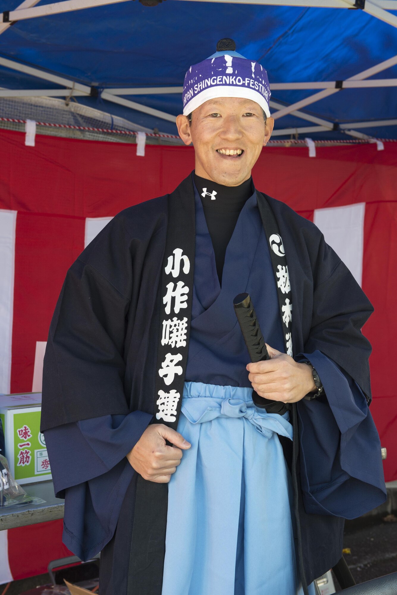 Masuhiro Shinozaki, 374th Aerospace Medicine Squadron bioenvironmental technician, poses for a photo at the Japan Culture Day event hosted by the Japanese Welfare Association at Yokota Air Base, Japan, Jan. 13, 2017. The event included traditional festival food, a performance from the Samurai Taiko Drum Team, musicians playing the koto and shamisen and tea ceremonies. (U.S. Air Force photo by Senior Airman David C. Danford)
