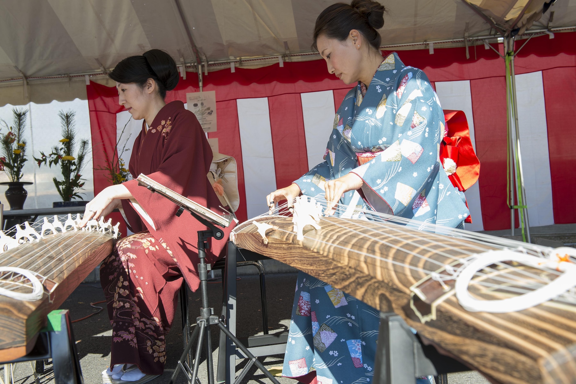 Musicians play the koto during the Japan Culture Day event hosted by the Japanese Welfare Association at Yokota Air Base, Japan, Jan. 13, 2017. The event also included traditional festival food, a performance from the Samurai Taiko Drum Team, and tea ceremonies. (U.S. Air Force photo by Senior Airman David C. Danford)