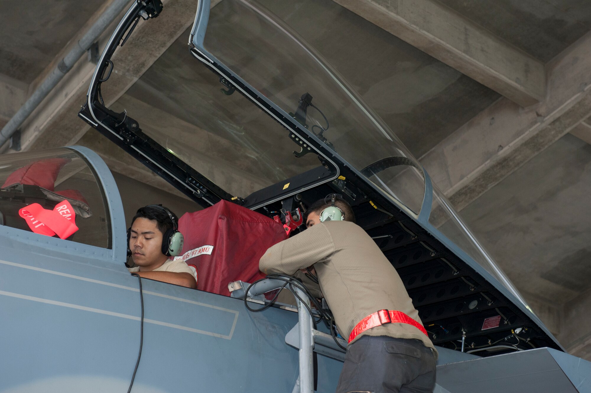 U.S. Air Force Senior Airmen Jason Garciadealba and Adrian Garrucho, 67th Aircraft Maintenance Unit avionics technicians, check the flight controls of an F-15 Eagle Jan. 10, 2017, at Kadena Air Base, Japan. Avionics technicians check aircraft systems daily for functionality to maintain mission readiness. (U.S. Air Force photo by Senior Airman Lynette M. Rolen/Released)