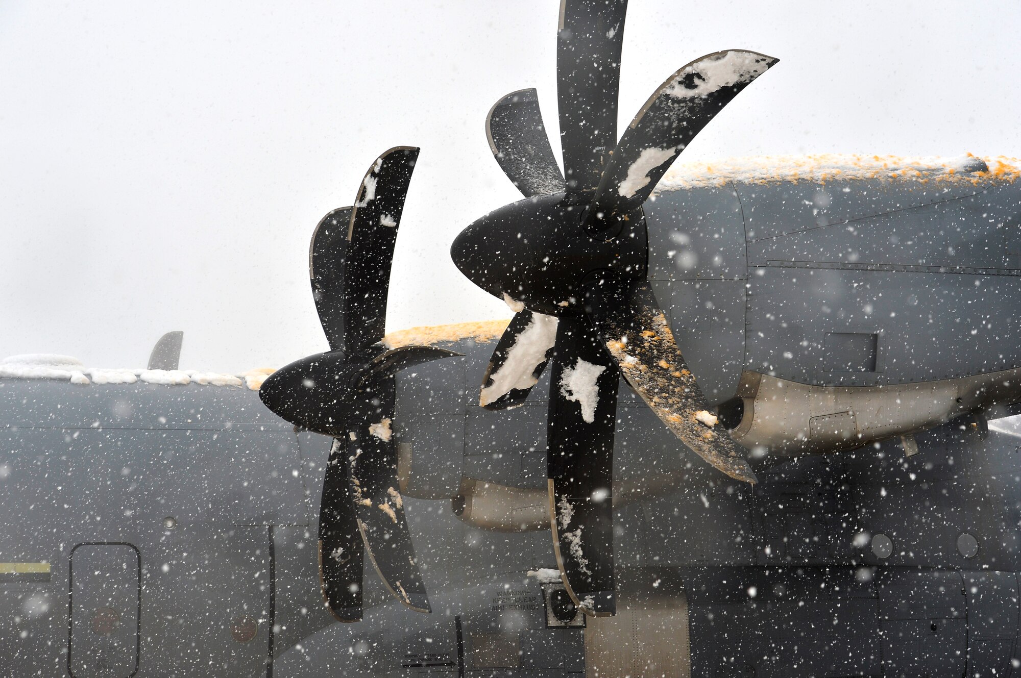 Snow and de-icing fluid stick to the propellers and engines on a C-130J Super Hercules at Ramstein Air Base, Germany, Jan. 10, 2017 The 86th Aircraft Maintenance Squadron conducted de-icing procedures on aircraft after a heavy snowfall on the installation and surrounding areas. The fluid helps prevent build-up of snow for a certain amount of time. (U.S. Air Force photo by Airman 1st Class Joshua Magbanua)