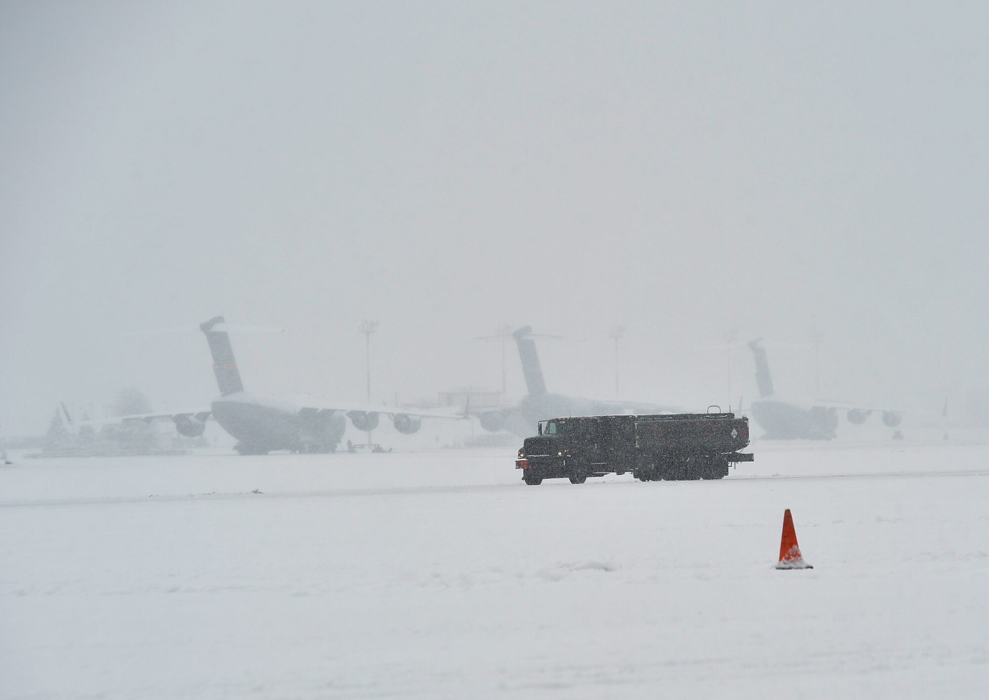 A military fuel truck drives on the flightline at Ramstein Air Base, Germany, Jan. 10, 2017. The Kaiserslautern Military Community received a record snowfall of approximately 3 1/2 inches in one day, making it the largest snowfall in a 24-hour period in the area since 2009. Local weather studies report that the state of Rheinland-Pfalz receives an average of 24.4 inches of precipitation each year. (U.S. Air Force photo by Airman 1st Class Joshua Magbanua)