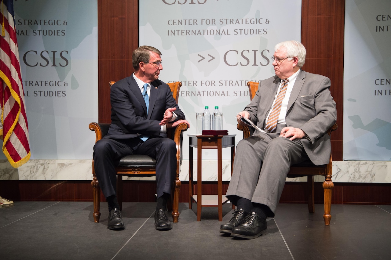 Defense Secretary Ash Carter speaks with John J. Hamre, the president and CEO of the Center for Strategic and International Studies, during the Sam Nunn National Security Leadership Prize and Lecture at CSIS headquarters in Washington, Jan. 11, 2017. DoD photo by Army Sgt. Amber I. Smith