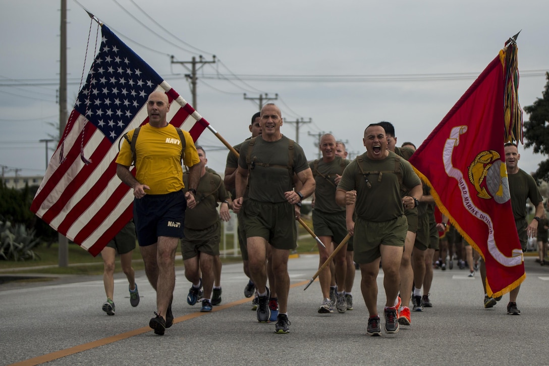 Maj. Gen. Richard L. Simcock II, commanding general of 3rd Marine Division, runs with his Marines and Sailors prior to his change of command on Camp Hansen, Okinawa, Japan, Jan. 12, 2017. The run celebrated the accomplishments of each Division Marine and Sailor during Simcock's time in the command. 