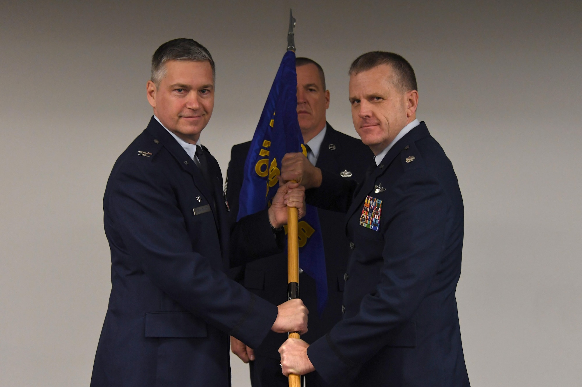 Lt. Col. Gregory D. Buchanan receives the 758th Airlift Squadron guideon from 911th Airlift Wing Commander Col. Douglas Strawbridge during a change of command ceremony at the Pittsburgh International Airport Air Reserve Station, January 8, 2017. Buchanan received command while facing a possible mission change and upcoming deployment cycle, and he aims to keep the squadron in the right direction. (U.S. Air Force photo by Staff Sgt. Marjorie A. Bowlden)