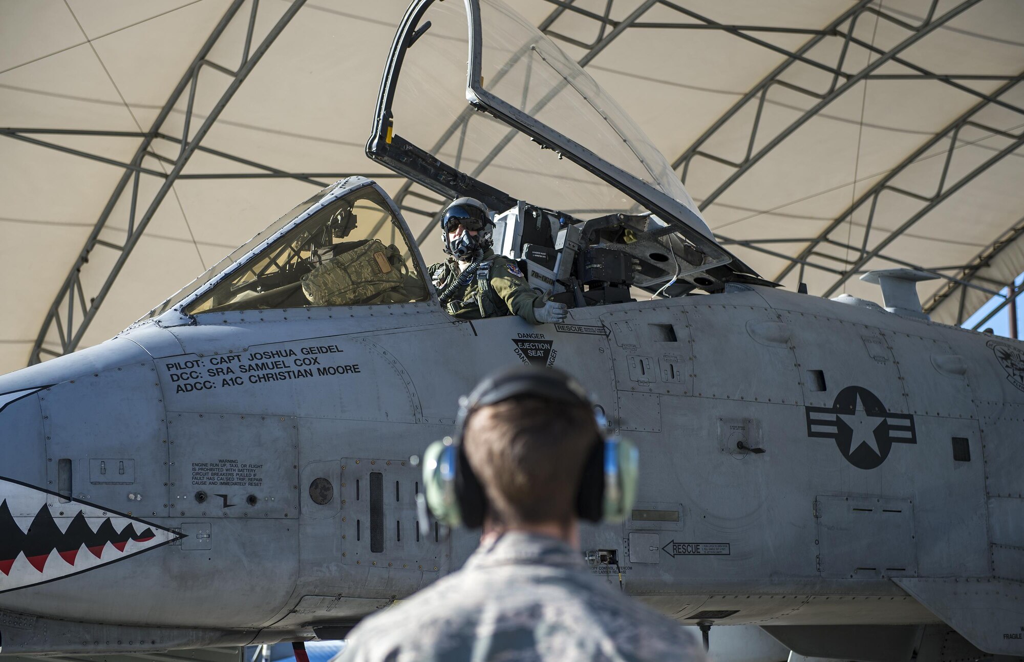 Capt. Thomas Ainscough, 74th Fighter Squadron A-10C Thunderbolt II pilot, talks with Senior Airman John Johnson, 23d Aircraft Maintenance Squadron crew chief, while waiting to taxi to the runway, Jan. 12, 2017, at Moody Air Force Base, Ga. All four military branches participate in two Green Flag exercises annually. (U.S. Photo by Airman 1st Class Janiqua P. Robinson)