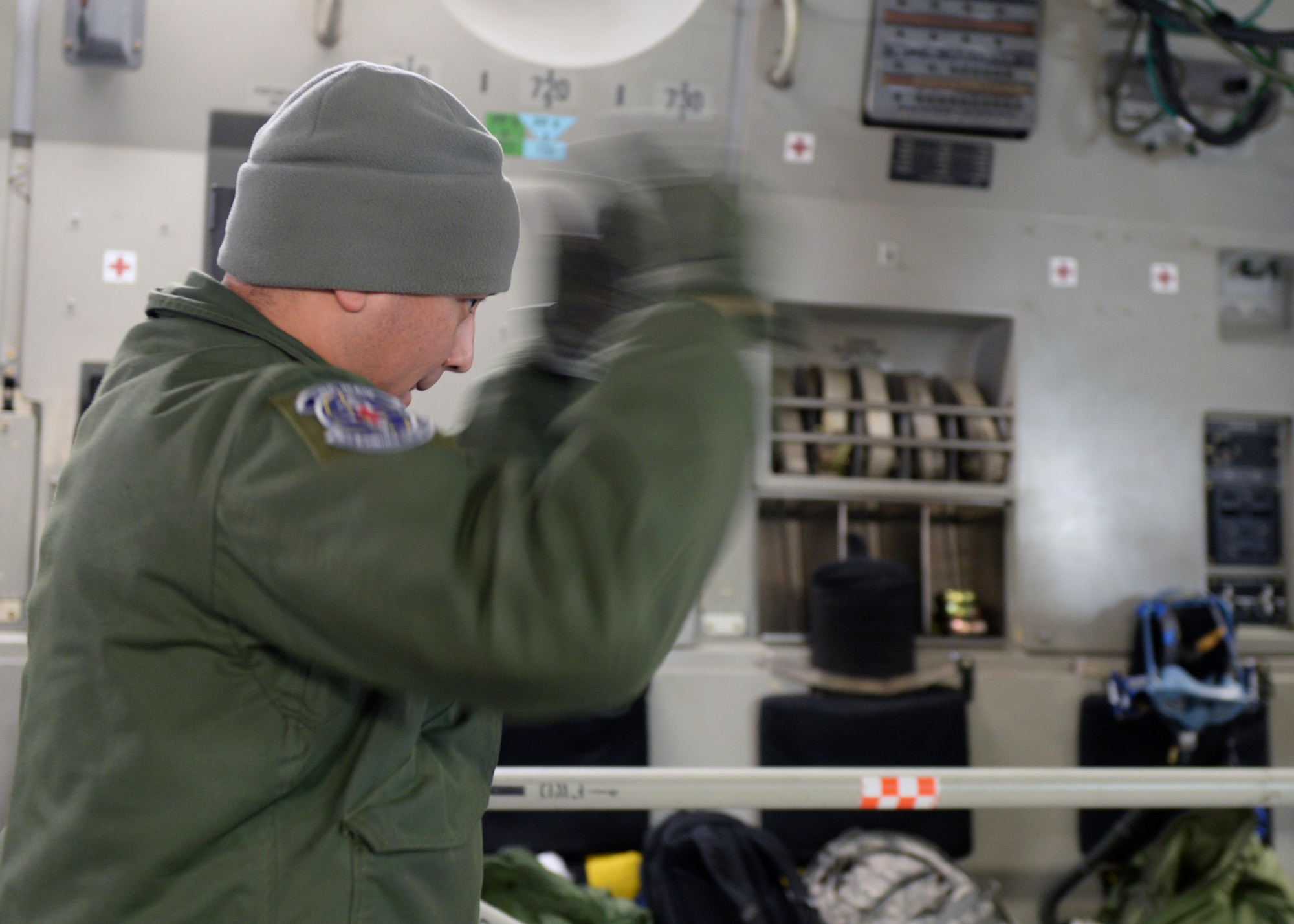 Tech. Sgt. Pablo Vasquez, 86th Aeromedical Evacuation Squadron aeromedical evacuation technician, directs the movement of simulated patients during an exercise on Ramstein Air Base, Germany, Jan. 11, 2017. Direction, instruction and attention to detail is crucial during aeromedical operations to ensure a quick and safe transfer of patients from one location to the next. (U.S. Air Force photo by Senior Airman Jimmie D. Pike)