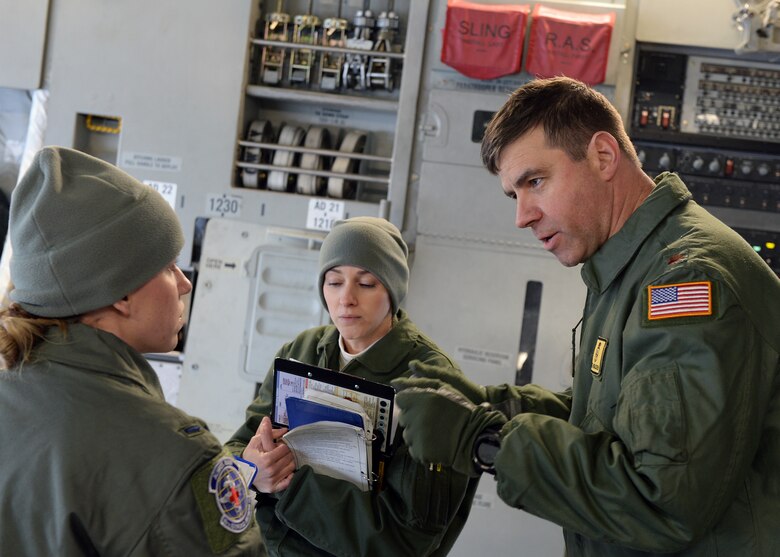 Maj. Matthew Bracken, 86th Medicine Squadron critical care nurse, and 1st Lt. Katelyn Dunahoe, 86th Aeromedical Evacuation Squadron flight nurse, discuss aspects of an exercise on Ramstein Air Base, Germany, Jan. 11, 2017. Medical personnel from Ramstein and Landstuhl Regional Medical Center trained together to develop their interoperability. (U.S. Air Force photo by Senior Airman Jimmie D. Pike)