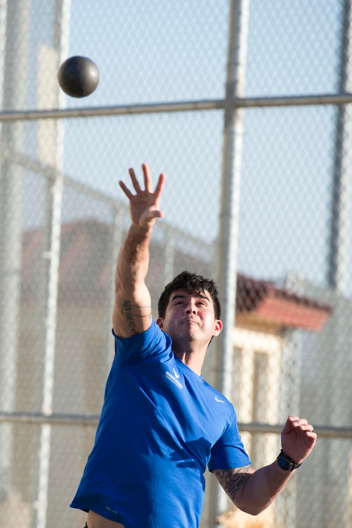 Staff Sgt. Bryan Nelson, 802nd Security Forces Squadron training NCO and Air Force wounded warrior, throws a shot put ball at Joint Base San Antonio-Randolph Jan. 11, 2017. Nelson is a participant in the Air Force Wounded Warrior (AFW2) Warrior Care week-long event, which aims to provide wellness events for seriously wounded, ill and injured military members, veterans and their caregivers. (U.S. Air Force photo by Airman 1st Class Lauren Parsons/Released)