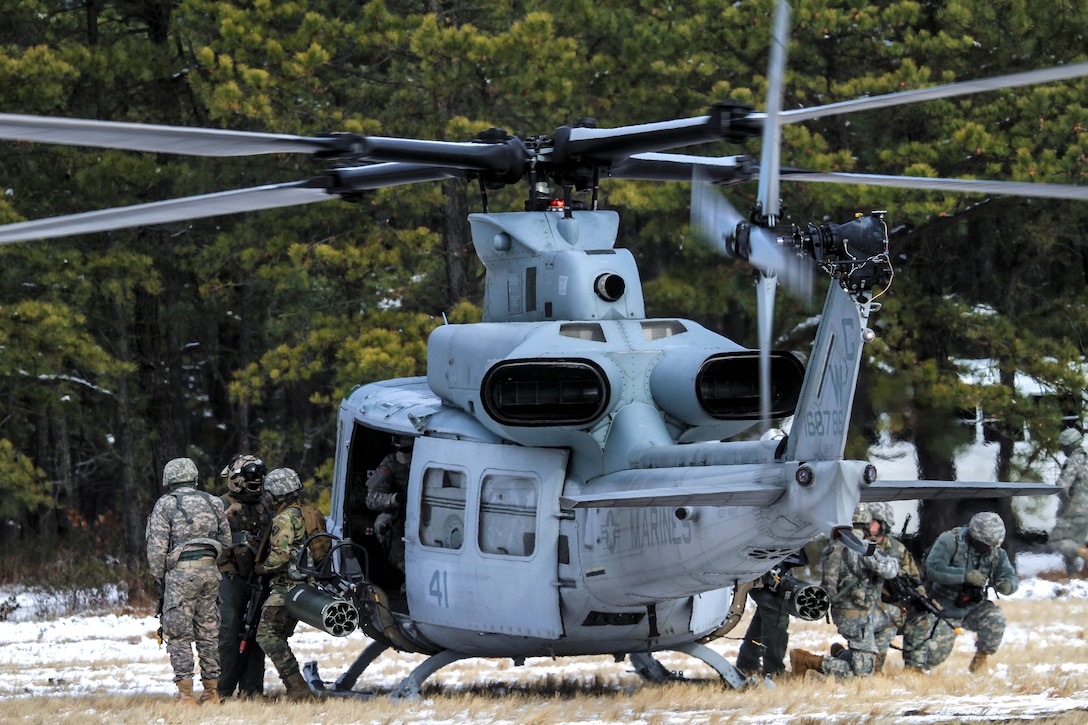 A Marine Corps Reserve UH-1Y Huey helicopter deploys New Jersey National Guard soldiers at a landing zone during a joint-training exercise at Joint Base McGuire-Dix-Lakehurst, N.J., Jan. 10, 2017. Air National Guard photo by Tech. Sgt. Matt Hecht