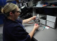 Beate Steinbacher, 86th Dental squadron dental lab technician, rough finishes pressed porcelain crowns at Ramstein Air Base, Germany, Jan. 11, 2017. The 14 personnel assigned to Ramstein’s area dental lab fabricate retainers, mouth guards, dentures, porcelain crowns, implants, and more for Airmen in 64 treatment facilities within U.S. Air Forces in Europe, United States Africa Command, and deployed locations in the region. (U.S. Air Force photo by Airman 1st Class Savannah L. Waters)