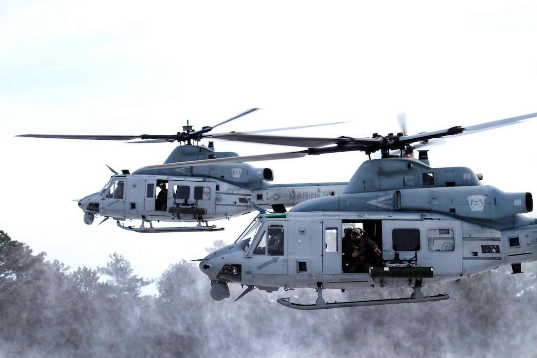 Two Marine Corps Reserve UH-1Y Huey helicopters liftoff from a landing zone at Joint Base McGuire-Dix-Lakehurst, N.J., Jan. 10, 2017. Air National Guard photo by Tech. Sgt. Matt Hecht