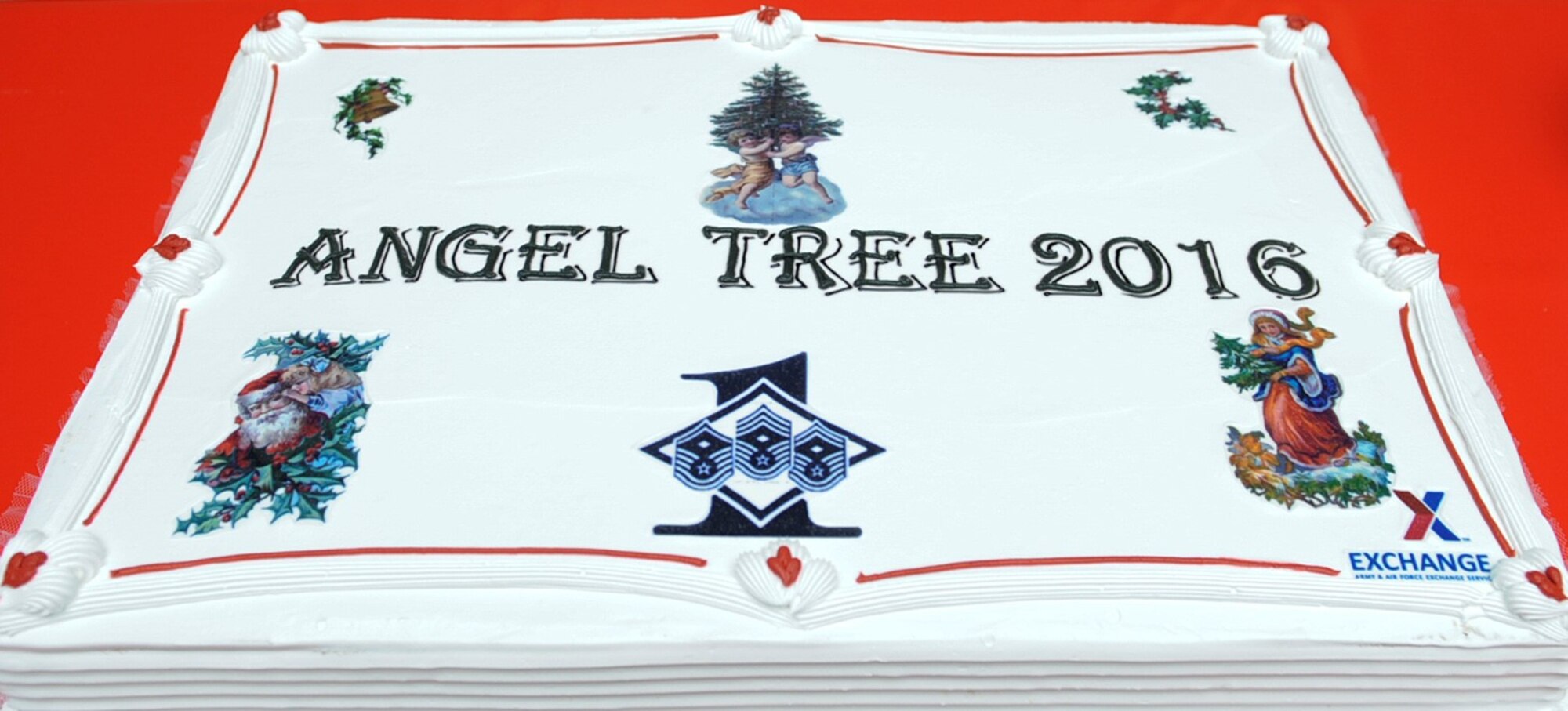 A cake is displayed at the 2016 Angel Tree ceremony at Ramstein Air Base, Germany, Nov. 8, 2016. This year 233 Air Force, Army, and Navy Families received Angel Tree donations, affecting more than 400 children’s lives. (U.S. Air Force photo by Airman 1st Class Savannah L. Waters)