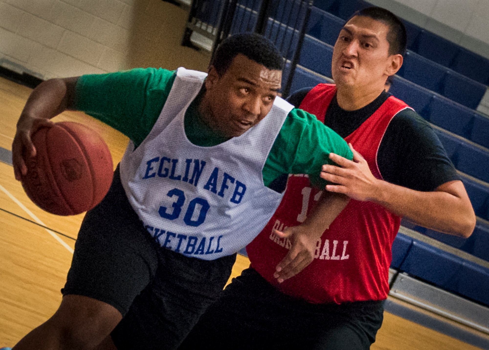 A Maintenance Squadron player drives on a Medical Group Black defender during their intramural basketball game at Eglin Air Force Base, Fla., Jan. 12.  The MDG team won easily 30 to 25 in their first game of the new intramural season.  (U.S. Air Force photo/Samuel King Jr.)