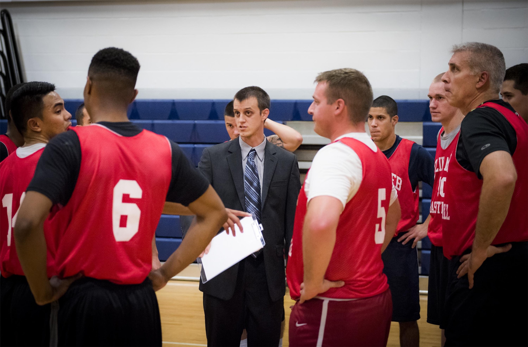 David Nystrom, the Medical Group Black coach, sets up a play during an intramural basketball game against the Maintenance Squadron team at Eglin Air Force Base, Fla., Jan. 12.  The MDG team won easily 30 to 25 in their first game of the new intramural season.  (U.S. Air Force photo/Samuel King Jr.)