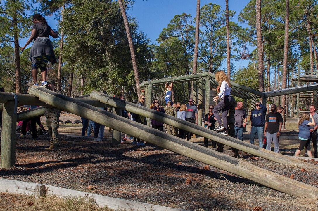 Educators and influencers from both Fort Lauderdale and Orlando traverse multiple obstacles that are part of the Confidence Course aboard Marine Corps Recruit Depot Parris Island, January 12, 2017. The Confidence Course consists of multiple obstacles that assist recruits in overcoming certain fears, which makes up one of the many events that occur during the Educators Workshop. The Educators Workshop provides the opportunity for educators to have an inside look at Marine Corps training to better inform their students in their local area. (Photo by Cpl. John-Paul Imbody/Released)