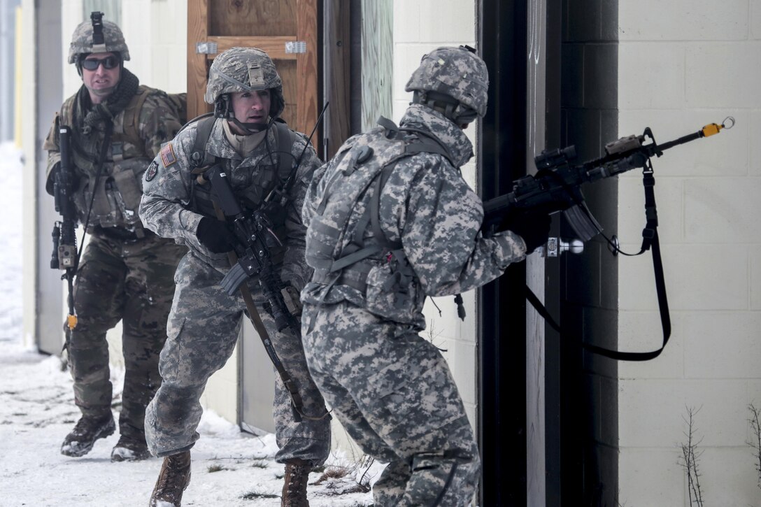 New Jersey Army National Guardsmen breech a door during a joint-training exercise at Joint Base McGuire-Dix-Lakehurst, N.J., Jan. 10, 2017. Air National Guard photo by Tech. Sgt. Matt Hecht