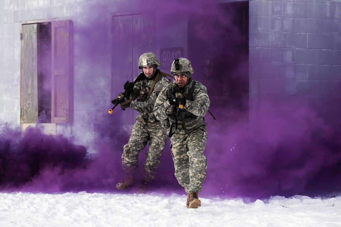 New Jersey Army National Guardsmen run through smoke cover during a joint-training exercise at Joint Base McGuire-Dix-Lakehurst, N.J., Jan. 10, 2017. Air National Guard photo by Tech. Sgt. Matt Hecht