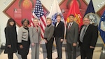 DLA Distribution deputy commander Twila Gonzales, Senior Executive Service, third from left, poses with the DLA Distribution honorees at the 49th annual employee recognition ceremony Dec. 15. From left to right are Rowena Gadin, Sandra Stephens, Gonzales, Barbara Eberly, Cathy Hampton, Jose Acosta and Kevin Henderson. 