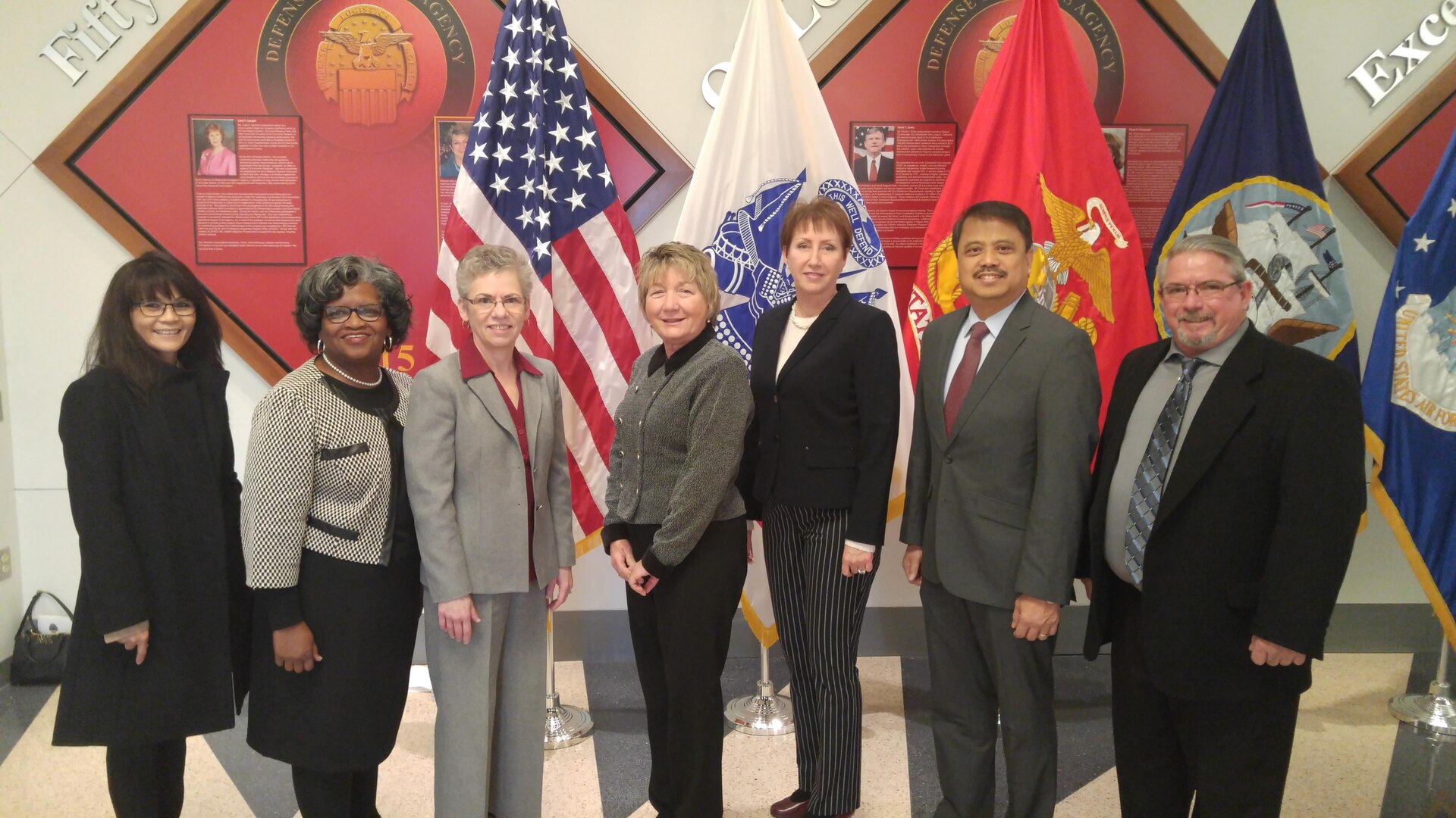 DLA Distribution deputy commander Twila Gonzales, Senior Executive Service, third from left, poses with the DLA Distribution honorees at the 49th annual employee recognition ceremony Dec. 15. From left to right are Rowena Gadin, Sandra Stephens, Gonzales, Barbara Eberly, Cathy Hampton, Jose Acosta and Kevin Henderson. 