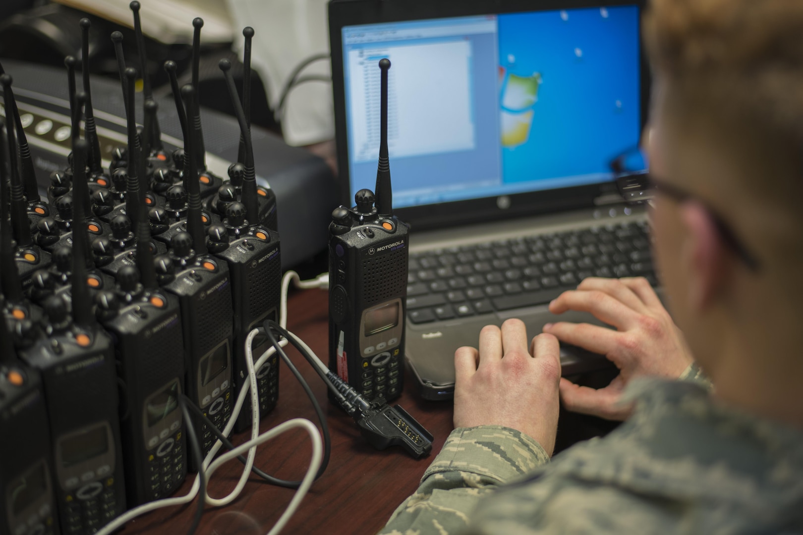 Senior Airman Jason Geiger, 744th Communications Squadron radio frequency transmission system technician, programs a land mobile radio on Joint Base Andrews, Md., Jan. 11, 2017. The 744th CS distributed approximately 200 LMRs to Airmen participating in the 58th Presidential Inauguration. Keeping Airmen connected is one of the 744th CS’s primary mission during the inauguration. (U.S. Air Force photo by Airman 1st Class Valentina Lopez)