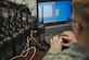 Senior Airman Jason Geiger, 744th Communications Squadron radio frequency transmission system technician, programs a land mobile radio on Joint Base Andrews, Md., Jan. 11, 2017. The 744th CS distributed approximately 200 LMRs to Airmen participating in the 58th Presidential Inauguration. Keeping Airmen connected is one of the 744th CS’s primary mission during the inauguration. (U.S. Air Force photo by Airman 1st Class Valentina Lopez)