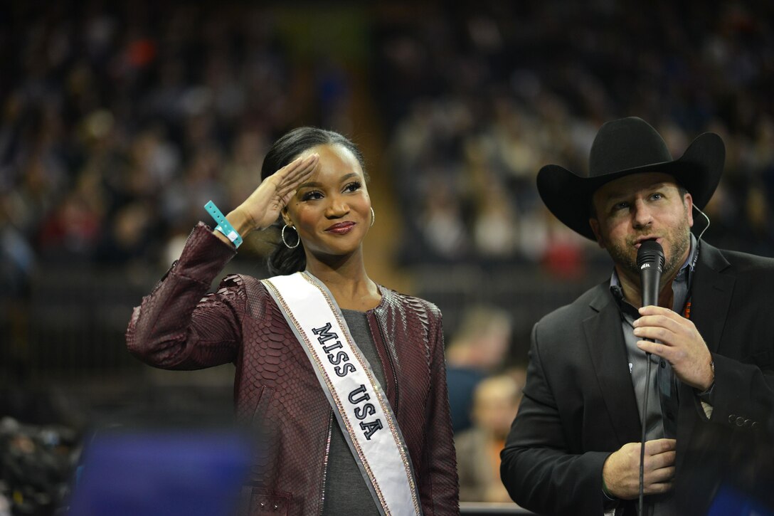 Army Capt. Deshauna Barber, Miss USA, salutes fans at Madison Square Garden in New York City, Jan. 6, 2017. Barber is assigned to the Army Reserve's 988th Quartermaster Detachment at Fort Meade, Md., and is the first military officer to be awarded the title of Miss USA. Air National Guard photo by Staff Sgt. Christopher S. Muncy