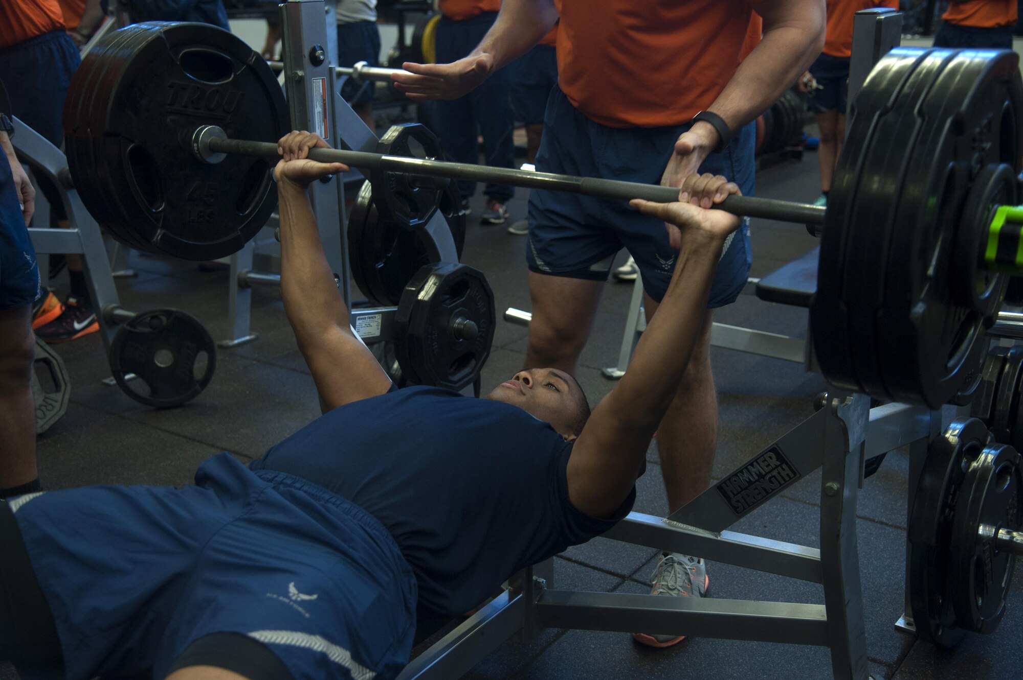 A member of Team MacDill maxes out on the bench press during the weight lifting portion of the 4th annual 5k and weight lifting competition to honor Maj. Raymond Estelle at MacDill Air Force Base, Fla., Jan. 13, 2017. After a 5k run, Airmen gathered inside the fitness center to see who could lift the most weight. (U.S. Air Force photo by Airman 1st Class Rito Smith) 
