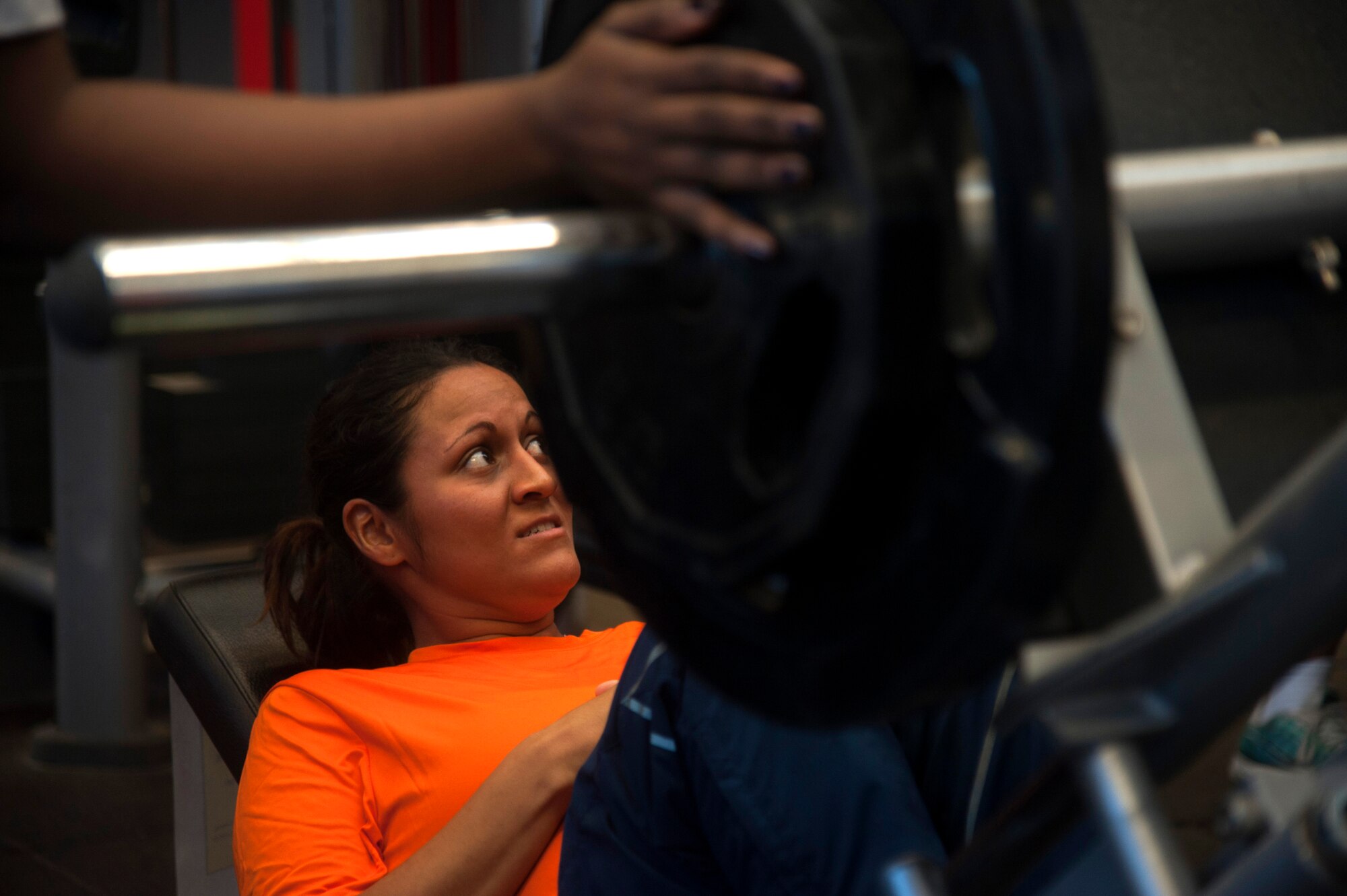 A member of Team MacDill leg presses during the 4th annual 5k and weight lifting competition to honor Maj. Raymond Estelle at MacDill Air Force Base, Fla., Jan. 13, 2017. The weight-lifting competition consisted of a bench press and leg press category. (U.S. Air Force photo by Airman 1st Class Rito Smith) 