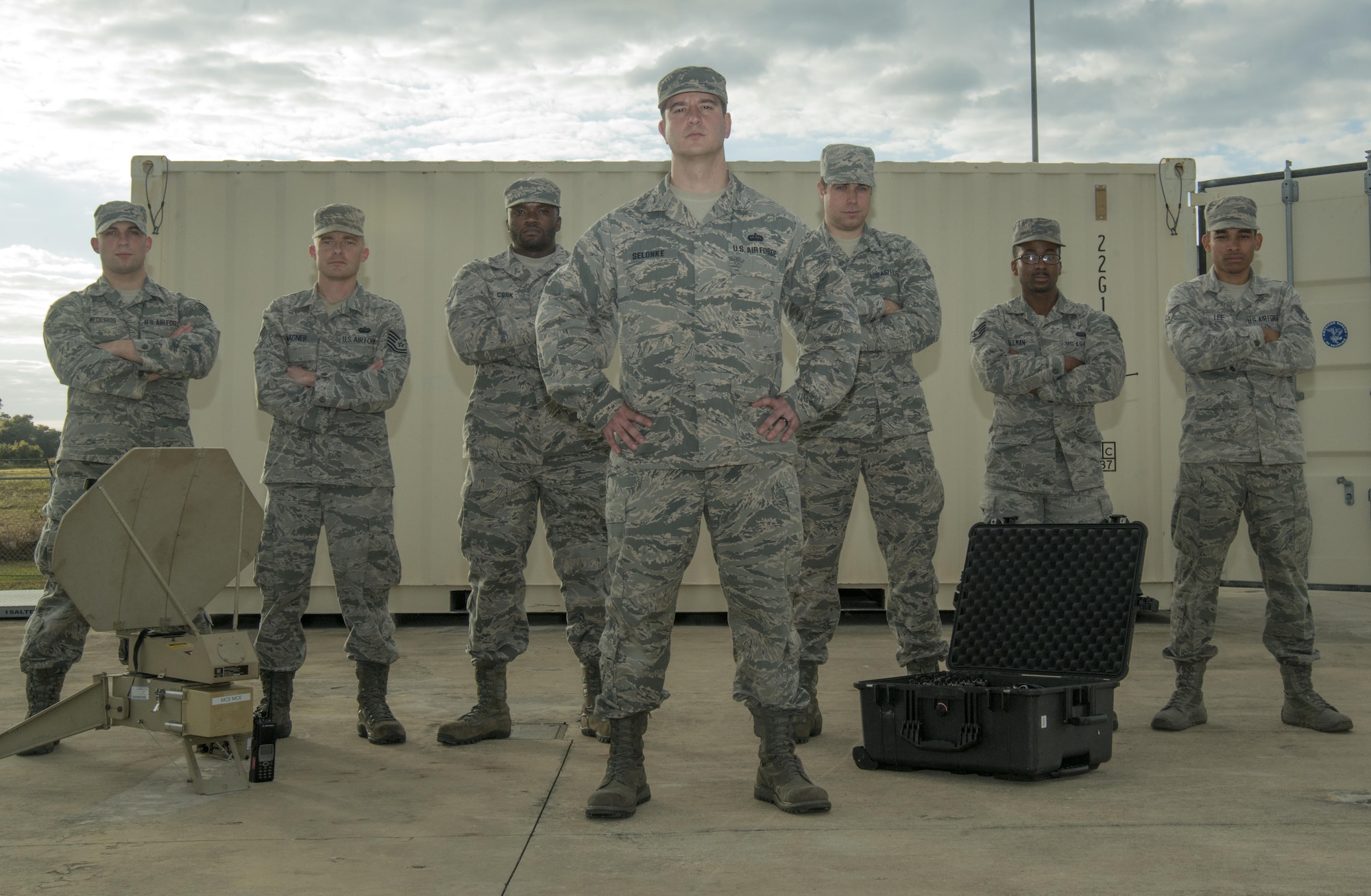 Tech. Sgt. Jeffrey Selonke, center, the section chief of network integration assigned to the 6th Communications Squadron, pauses for a photo with his team at MacDill Air Force Base, Fla., Jan. 11, 2017. Selonke won the 2016 Air Force Information Dominance Outstanding Cyber Systems NCO of the Year award during his time as the section chief of radio frequency transmissions. (U.S. Air Force photo by Airman 1st Class Mariette Adams)
