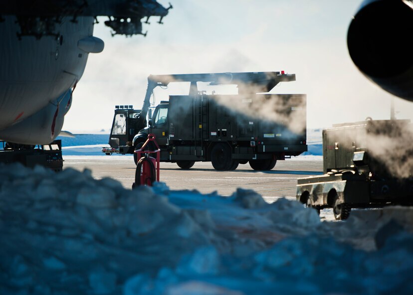 Airman 1st Class Samantha Coleman, 5th Aircraft Maintenance electronic countermeasures specialist, de-ices a B-52H Stratofortress at Minot Air Force Base, N.D., Jan. 11, 2017. A mixture of heated fluid and hot water is sprayed on the bombers prior to launching in cold weather conditions. 5th AMXS Airmen work in all weather conditions to provide B-52 global strike capabilities. (U.S. Air Force photo/Airman 1st Class J.T. Armstrong)