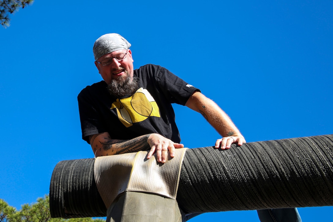 Scott Guelcher an Art Teacher at Island Coast High School participates in the Confidence Course during the Educators Workshop aboard Recruit Depot Parris Island, South Carolina, January 12, 2017. The educators come from both Recruiting Station Fort Lauderdale and Orlando to experience the Educators Workshop. The Educators Workshop provides an opportunity to educators to have an inside look at Marine Corps traning to better inform their students in their local area. ( U.S. Marine Corps photo by Lance Cpl. Jack A. E. Rigsby/Released)