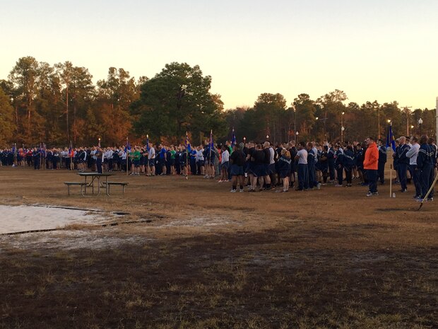 Members of Team Charleston listen to opening comments for the Wingman Day Olympics here, Jan. 13. For Wingman Day Airmen participated in various events with their squadrons to foster teamwork and communication while covering the four domains of Comprehensive Airmen Fitness.