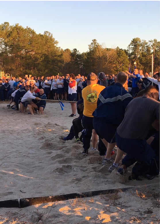 Members of Team Charleston compete in tug-of-war during the Wingman Day Olympics here, Jan. 13. For Wingman Day Airmen participated in various events with their squadrons to foster teamwork and communication while covering the four domains of Comprehensive Airmen Fitness.
