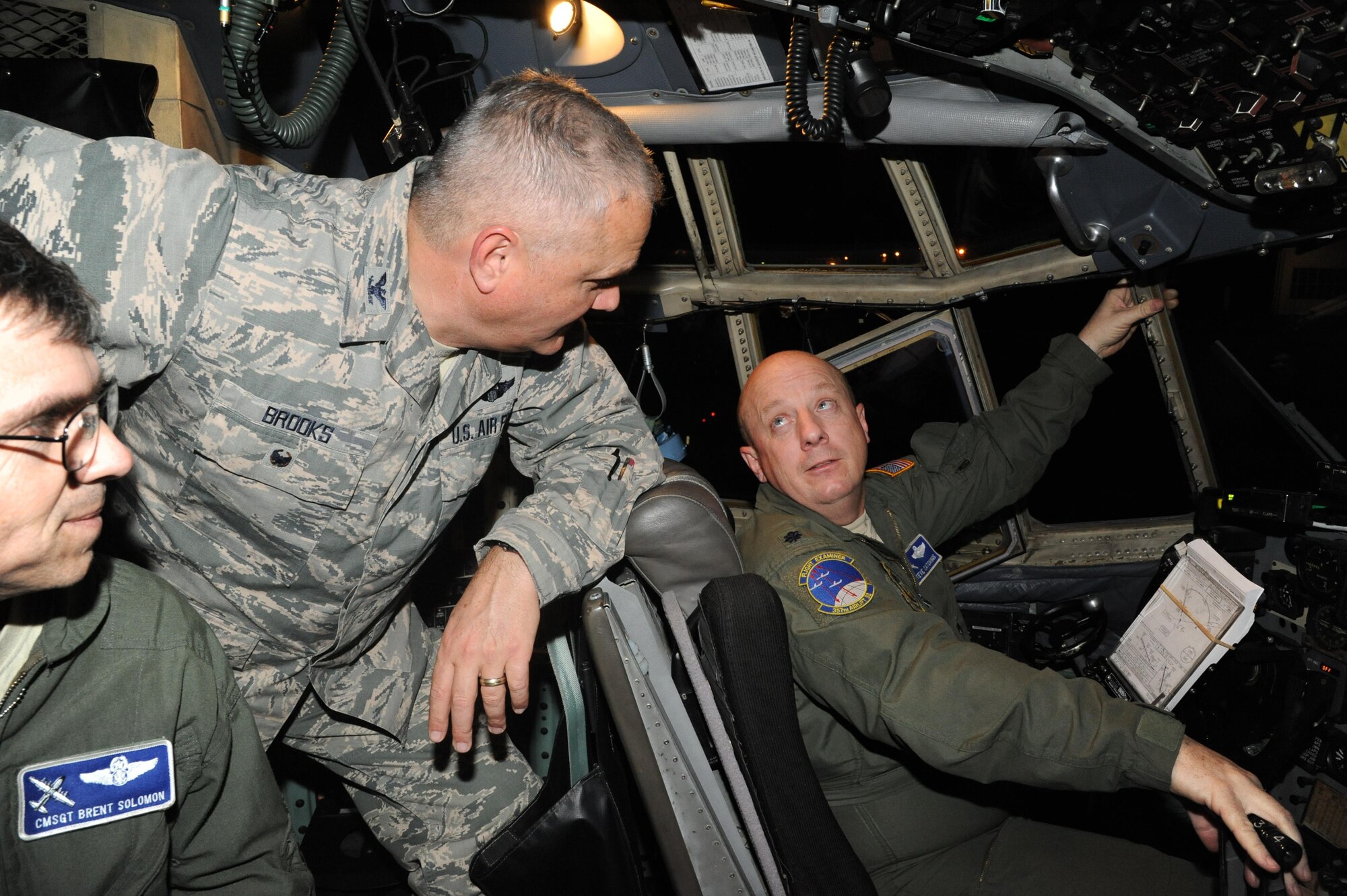 Col. Pat Brooks (Center), commander of the 908th Airlift Wing greets Lt. Col. Steve Catchings (Right), aircraft commander and Chief Master Sgt. Brent Solomon, flight engineer after the newest 908th aircraft landed at Maxwell Air Force Base, Ala. Jan. 12. The C-130 Hercules came from Niagra Falls Air Force Reserve Station, N.Y.