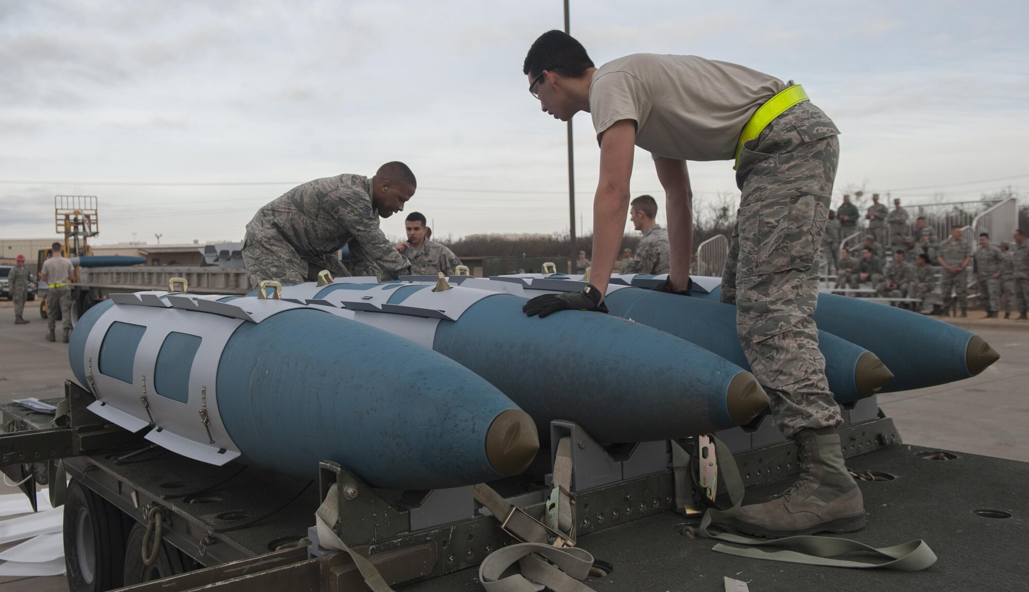 U.S. Air Force Airmen from the 7th Munitions Squadron green team assemble four GBU-31 V1 joint direct attack munitions at Dyess Air Force Base, Texas, Jan. 12, 2017. Two teams of nine Airmen each took part in the quarterly competition, in order to show off both technical prowess and team camaraderie within the squadron. (U.S. Air Force photo by Airman 1st Class Rebecca Van Syoc)