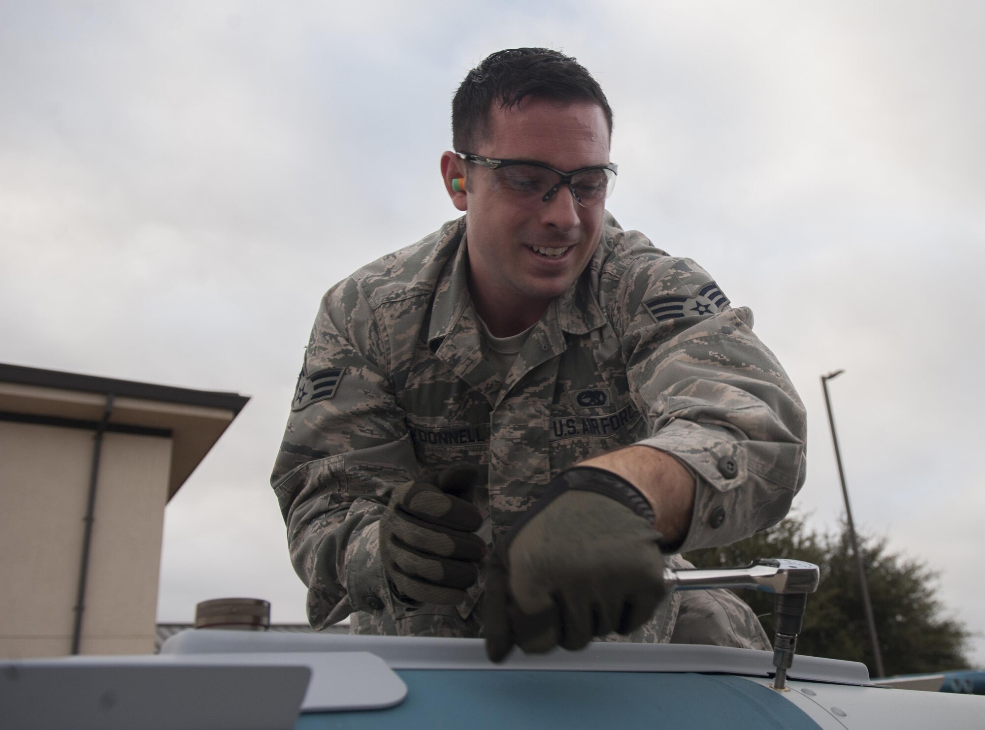 U.S. Air Force Senior Airman Ian O’Donnell, 7th Munitions Squadron gold team member, tightens the fastenings on a tail fin of a GBU-31 V1 joint direct attack munition at Dyess Air Force Base, Texas, Jan. 12, 2017. The bomb build competition is held quarterly, and helps Airmen learn leadership, technical knowledge and operational risk management. (U.S. Air Force photo by Airman 1st Class Rebecca Van Syoc)