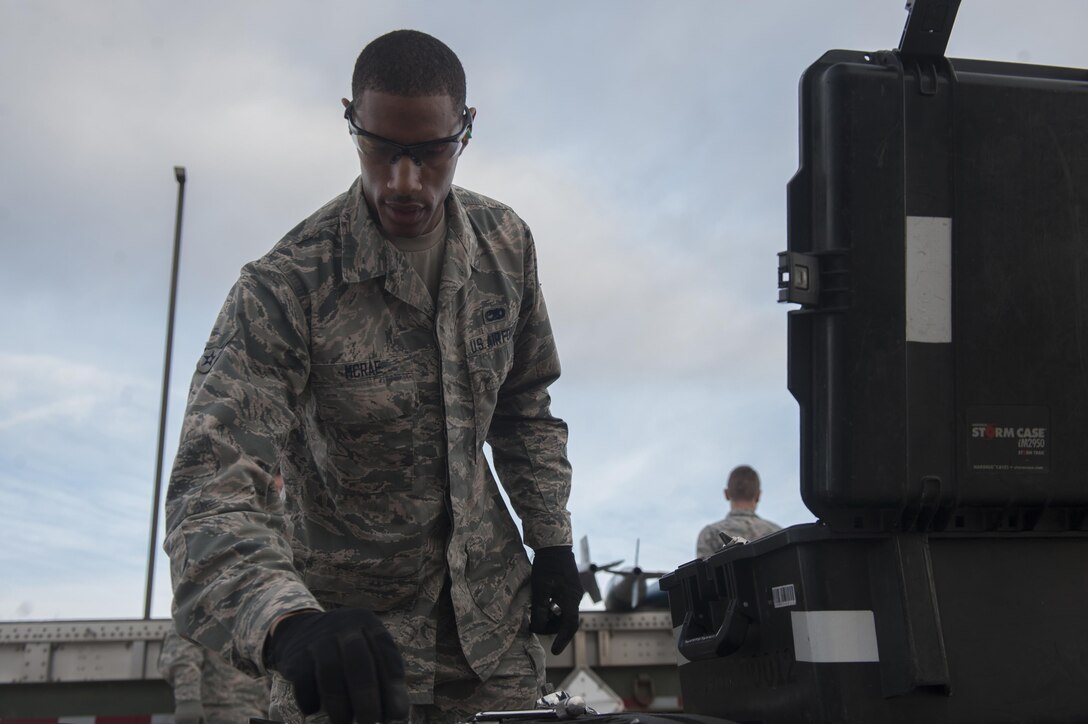 U.S. Air Force Airman 1st Class Andre McRae, 7th Munitions Squadron green team member, selects a tool from a toolkit during the 7th MUNS quarterly bomb build competition at Dyess Air Force Base, Texas, Jan. 12, 2017. The munitions built during the competition are slotted for use during future B-1B Lancer training missions. (U.S. Air Force photo by Airman 1st Class Rebecca Van Syoc)
