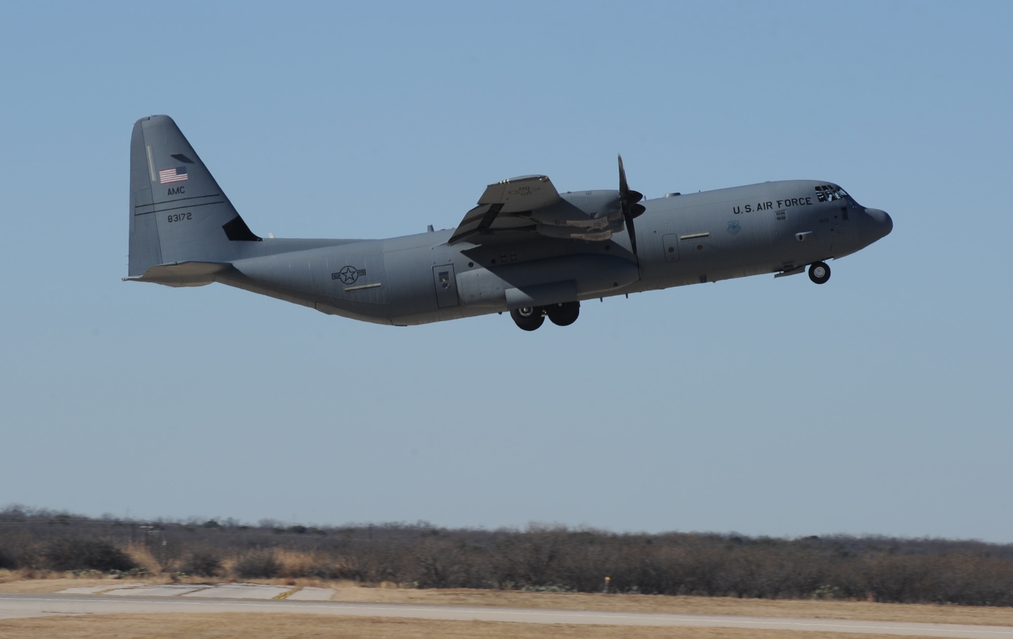 A C-130J Super Hercules takes off at Dyess Air Force Base, Texas, Jan. 7, 2017. Airmen and aircraft from the 39th Airlift Squadron deployed Jan. 6 and 7. 2017, to Afghanistan, to conduct tactical airlift missions. (U.S. Air Force photo by Airman 1st Class Emily Copeland)