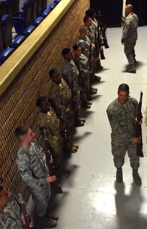 U.S. Air Force Staff Sgt. Michael Berish, a rations clerk with the 379th Expeditionary Force Support Squadron, instructs the base honor guard during practice at Al Udeid Air Base, Qatar, Nov. 28, 2016. Berish assumed the NCO in charge position of the team in October 2016. (U.S. Air Force photo by Senior Airman Cynthia A. Innocenti)