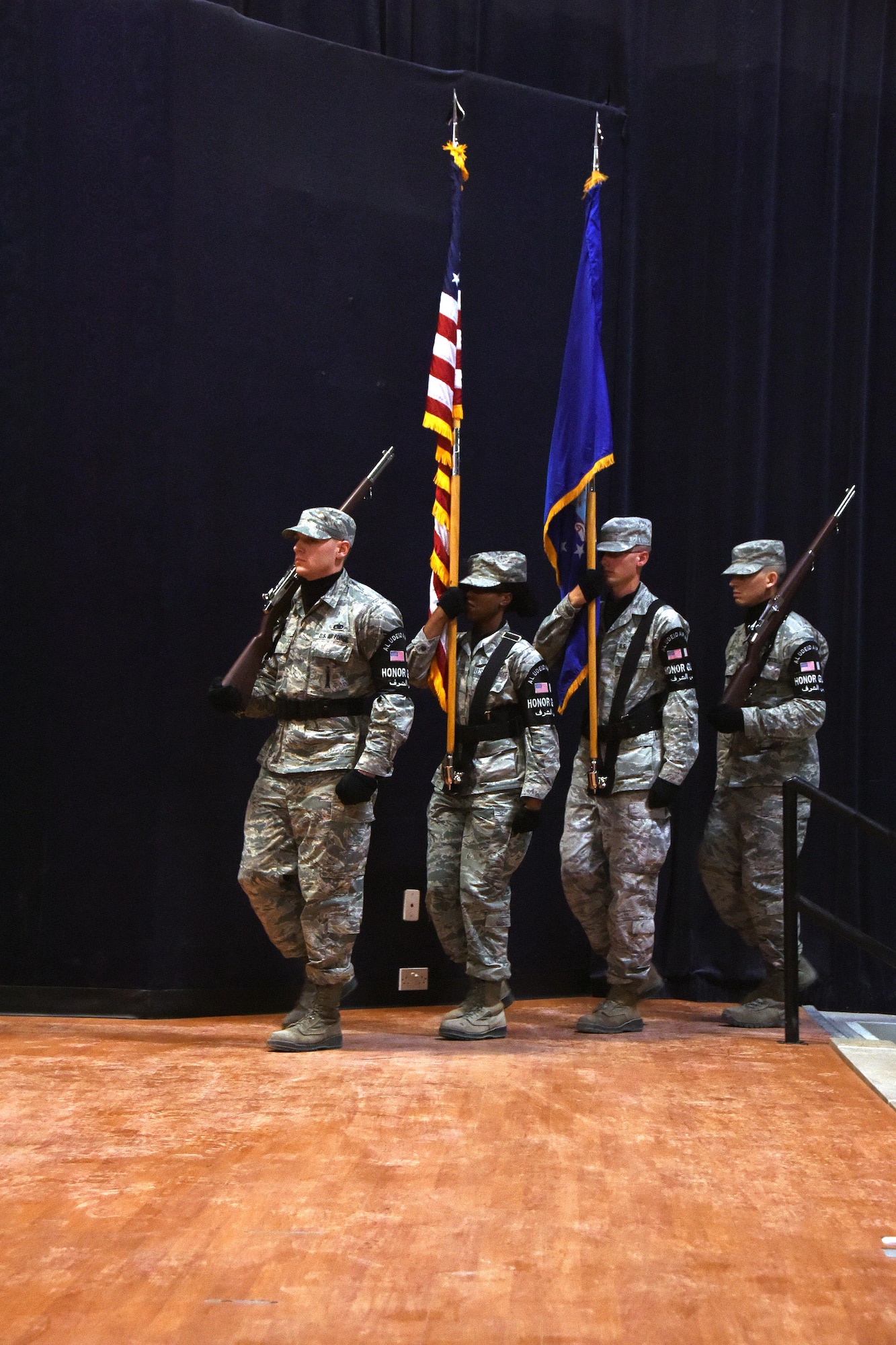 The Al Udeid Air Base Honor Guard presents the colors during a promotion ceremony at Al Udeid AB, Qatar, Dec. 2, 2016. The mission of the honor guard is to represent all others in their service with reverence and respect. (U.S. Air Force photo by Senior Airman Cynthia A. Innocenti)