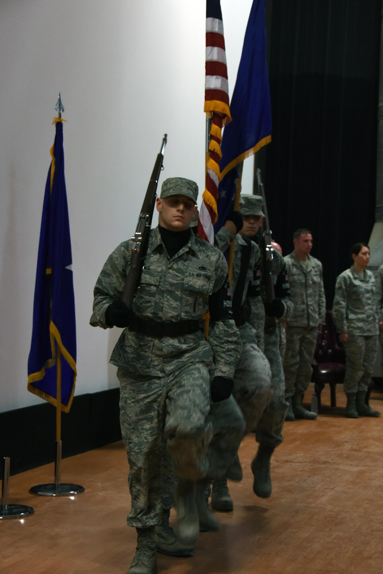 The Al Udeid Air Base Honor Guard presents the colors during a promotion ceremony at Al Udeid Air Base, Qatar, Dec. 2, 2016. The mission of the honor guard is to represent all others in their service with reverence and respect.  (U.S. Air Force photo by Senior Airman Cynthia A. Innocenti)