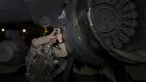 Capt. David, 79th Expeditionary Fighter Squadron pilot, performs a walk-around on an F-16 Fighting Falcon before a night mission Jan. 13, 2017 at Bagram Airfield, Afghanistan. David is at Bagram on his first deployment as a fighter pilot. (U.S. Air Force photo by Staff Sgt. Katherine Spessa)
