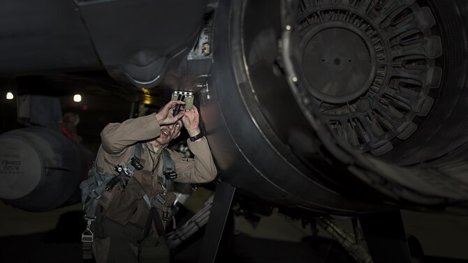 Capt. David, a 79th Expeditionary Fighter Squadron pilot, performs a prefight inspection on an F-16 Fighting Falcon before a night mission Jan. 13, 2017, at Bagram Airfield, Afghanistan. David is at Bagram Airfield on his first deployment as a fighter pilot. (U.S. Air Force photo/Staff Sgt. Katherine Spessa)