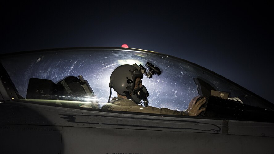 Capt. David, a 79th Expeditionary Fighter Squadron pilot, taxis an F-16 Fighting Falcon before a night mission Jan. 13, 2017, at Bagram Airfield, Afghanistan. To become a pilot, David went to school while working as a maintainer, through a deployment to Balad Airfield, Iraq, and temporary duties where he was often gone for three weeks out of every month. (U.S. Air Force photo/Staff Sgt. Katherine Spessa)