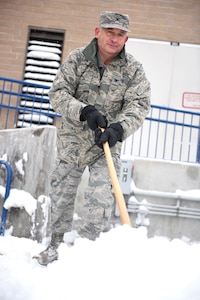Col. Jeffery D. Aebischer, Vice Wing Commander of the 124th Fighter Wing, helps with snow removal alongside other Airmen on base during the record-setting snowstorm that swept through Boise, Idaho in the early weeks of Jan. 2017.