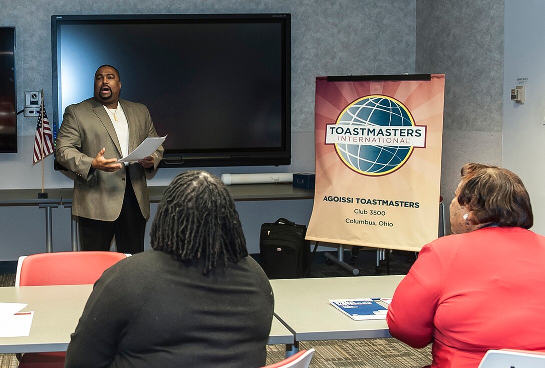 DLA Land and Maritime EEO Specialist Michael McCoy speaks during a Toastmaster International Club 3500 meeting inside the operations center at Defense Supply Center Columbus. A.G.O.I.S.S.I. (A Group Of Individuals Seeking Self Improvement) leads its district with the most consecutive years achieving 10 out of 10 annual goals set forth by the organization.