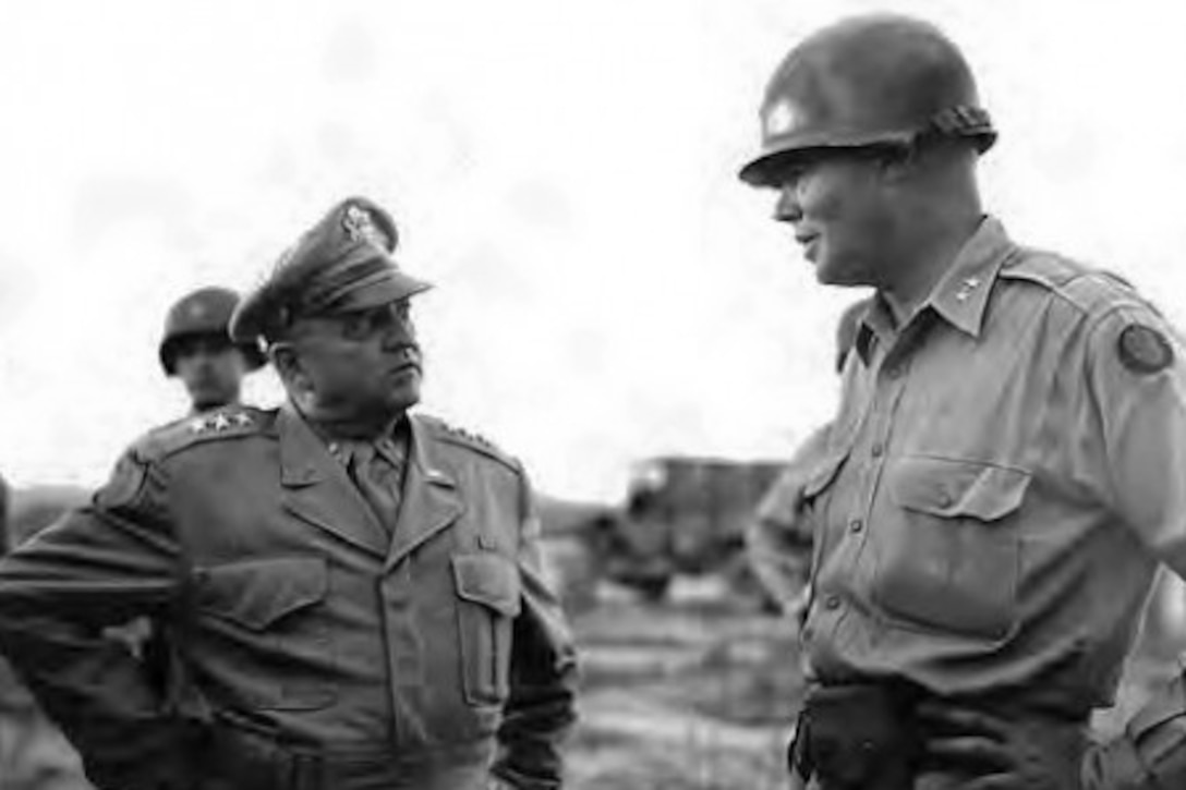 Army Maj. Gen. William F. Dean, right, greets Army Gen. Walton H. Walker upon his arrival in Taejon, South Korea, July 7, 1950. Photo courtesy National Archives