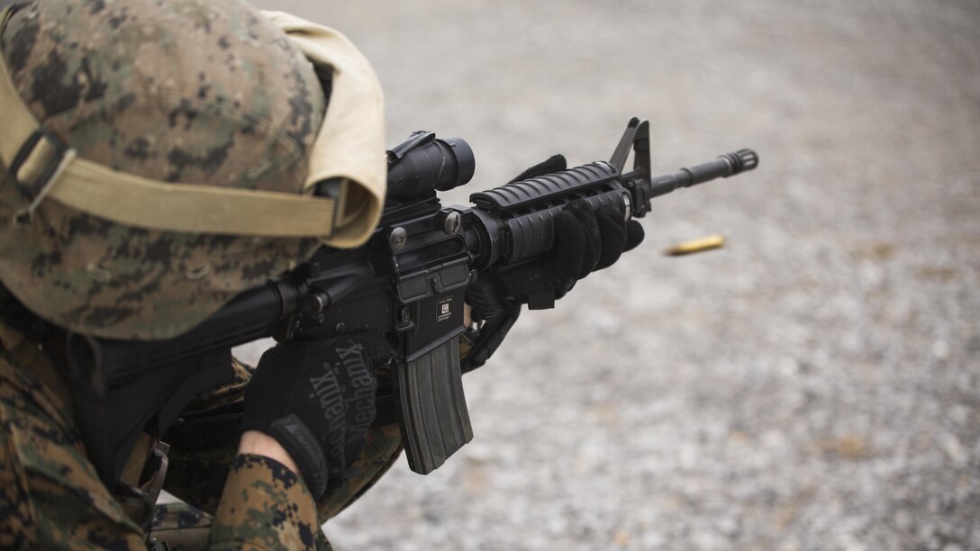 Capt. Ian Carter-Condon fires an M16A4 service rifle during table two of his annual rifle range qualification, Jan. 12, 2017, at Camp Hansen, Okinawa, Japan. The Marine Corps revised table two of the marksmanship program October 2016 to increase marksmanship skill and realism in a combat environment. Carter-Condon is an assistant operations officer with Combat Logistics Regiment-3, 3d Marine Logistics Group, III Marine Expeditionary Force. 